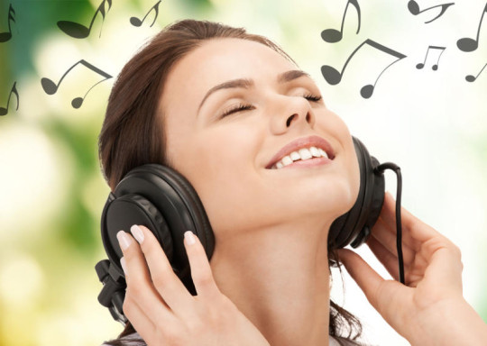 Girl Listening to Happy Music using Headphones