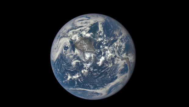 Moon Orbiting Earth from a million miles away in space