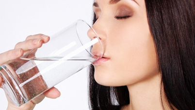 Women Drinking a Glass of Water